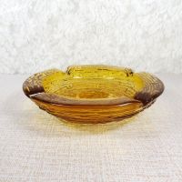 Vintage round gold glass ashtray with four cigarette rests. Textured outside, smooth on the inside: Top Side - Click to enlarge