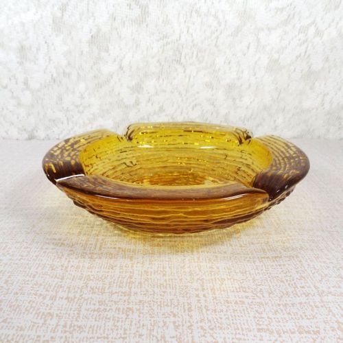 Vintage round gold glass ashtray with four cigarette rests. Textured outside, smooth on the inside: Top Side