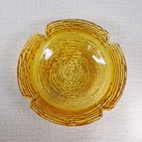 Vintage round gold glass ashtray with four cigarette rests. Textured outside, smooth on the inside: Top - Click to enlarge