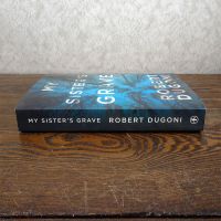 My Sister’s Grave by Robert Dugoni paperback book: Spine - Click to enlarge