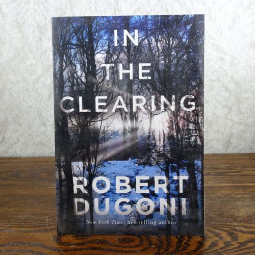 In the Clearing by Robert Dugoni paperback book: Front