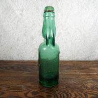 Codd Neck green glass self sealing soda bottle. Original rubber ring, marble. Raised foreign language: Right - Click to enlarge