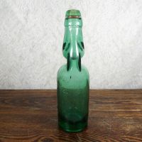 Codd Neck green glass self sealing soda bottle. Original rubber ring, marble. Raised foreign language: Left - Click to enlarge