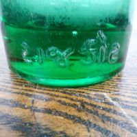 Codd Neck green glass self sealing soda bottle. Original rubber ring, marble. Raised foreign language: Writing Heel - Click to enlarge