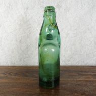 Codd Neck green glass self sealing soda bottle. Original rubber ring, marble. Staining - Air Bubbles: Front