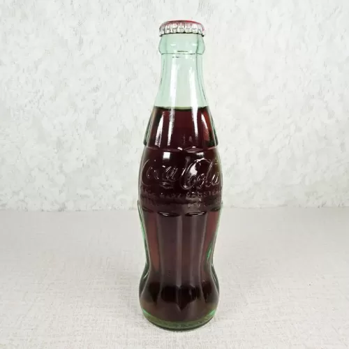 Denver Colorado vintage 8 oz full hobbleskirt no refill Coke bottle with Coca Cola Classic cap: Front