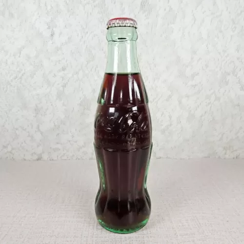 Jacksonville Florida vintage 8 oz full hobbleskirt no refill Coke bottle with Coca Cola Classic cap: Front