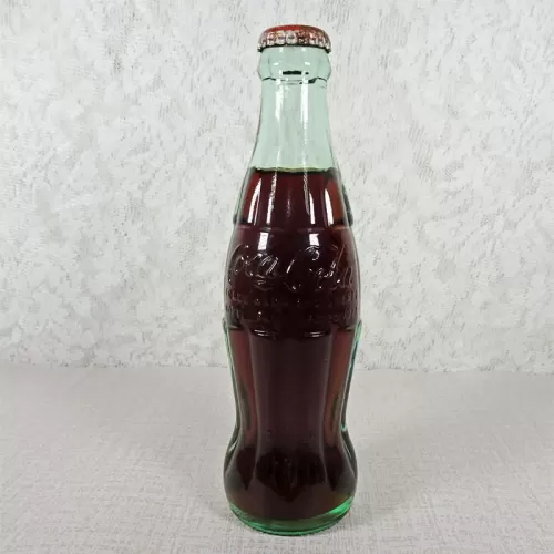 Peoria Illinois vintage 8 oz full hobbleskirt no refill Coke bottle with Coca Cola Classic cap: Front