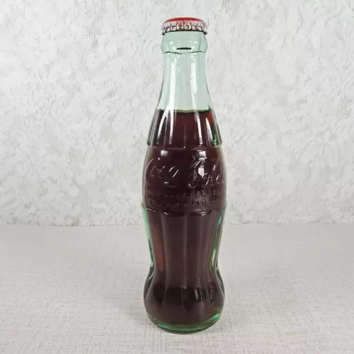 Boston Massachusetts vintage 8 oz full hobbleskirt no refill Coke bottle with Coca Cola Classic cap: Front