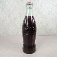 Jackson Mississippi vintage 6 oz full hobbleskirt Coke bottle with red Coca Cola Classic cap: Front