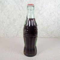 Jackson Mississippi vintage 6 oz full hobbleskirt Coke bottle with red Coca Cola Classic cap: Left - Click to enlarge