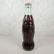 Las Vegas Nevada vintage 8 oz full hobbleskirt Coke bottle with red Coca Cola Classic cap: Front