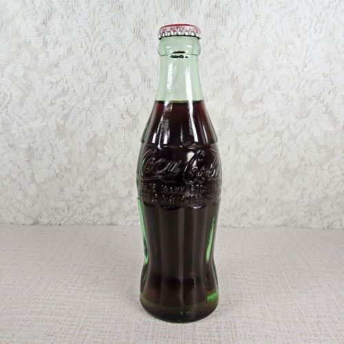 Durham North Carolina vintage 6 oz full hobbleskirt Coke bottle with red Coca Cola Classic cap: Front