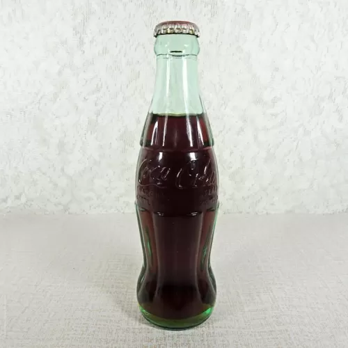 Austin Texas vintage 8 oz full hobbleskirt no refill Coke bottle with Coca Cola Classic cap: Front