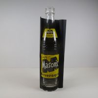 Mason’s Beverages vintage 10 fl. oz. empty ACL soda bottle with yellow and white graphics: Front on Black - Click to enlarge