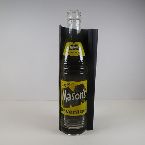 Mason’s Beverages vintage 10 fl. oz. empty ACL soda bottle with yellow and white graphics: Front on Black