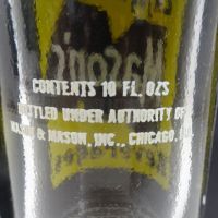 Mason’s Beverages vintage 10 fl. oz. empty ACL soda bottle with yellow and white graphics: Words on Back - Click to enlarge