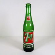 Vintage Seven Up soda bottle with the seven bubble logo. Green glass with red and white ACL graphics: Front