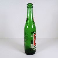 Vintage Seven Up soda bottle with the seven bubble logo. Green glass with red and white ACL graphics: Right - Click to enlarge