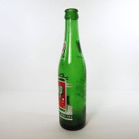 Vintage Seven Up soda bottle with the seven bubble logo. Green glass with red and white ACL graphics: Left - Click to enlarge