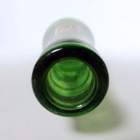 Vintage Seven Up soda bottle with the seven bubble logo. Green glass with red and white ACL graphics: Top - Click to enlarge