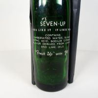 Vintage Seven Up soda bottle with the seven bubble logo. Green glass with red and white ACL graphics: Words Back - Click to enlarge