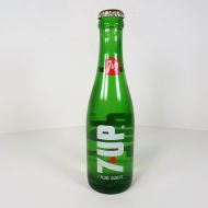 1969 vintage 7up full green glass soda bottle with red dot design: Front