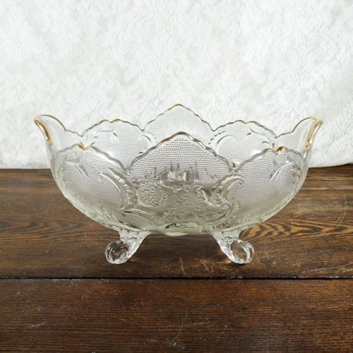 Vintage fruit bowl compote with four short legs. Clear glass with beautiful designs throughout: Front