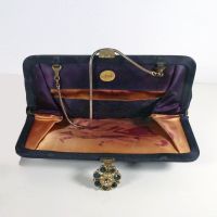 Ande vintage blue clutch purse with gold chain and brooch like clasp. Pair of scalloped gloves included: Inside - Click to enlarge