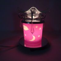 Electric oil warmer featuring a pink night sky of white stars, moon and clouds. Round mirror base: On - Click to enlarge