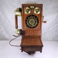 Vintage replica of an antique wood wall telephone with pushbuttons, a simulated crank handle, storage compartment and more: Front