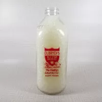 Olbrych's Dairy vintage clear glass acl one quart milk bottle with red graphics and textured body: Back - Click to enlarge