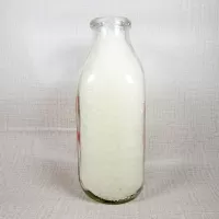 Thiele Dairy vintage clear glass acl one quart milk bottle with red graphics: Right - Click to enlarge