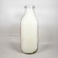 Thiele Dairy vintage clear glass acl one quart milk bottle with red graphics: Left - Click to enlarge
