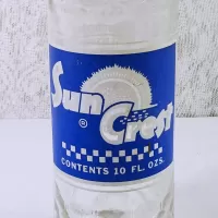 1966 Sun Crest 10 oz Vintage ACL Soda Bottle. Blue white graphics. Raised ovals above and below label #4b: Logo - Click to enlarge