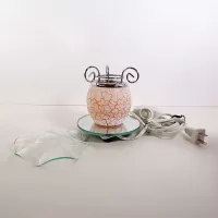 Electric scented oil tart warmer with white crackle design on orange background. Round mirror base: Parts View - Click to enlarge