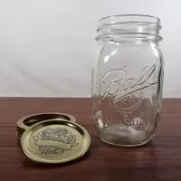 Vintage Ball mason jar with measuring increments on sides of the jar. Design on gold lid and back: Lid Off - Click to enlarge
