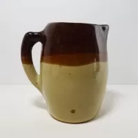 Antique glazed stoneware pitcher with handle. Brown top, beige bottom, band of a third color separating them: Right - Click to enlarge